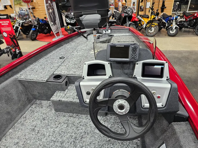 Slide: The Image of 2025 Tracker Pro Team 175 boat interior with steering wheel and control panel. - 7
