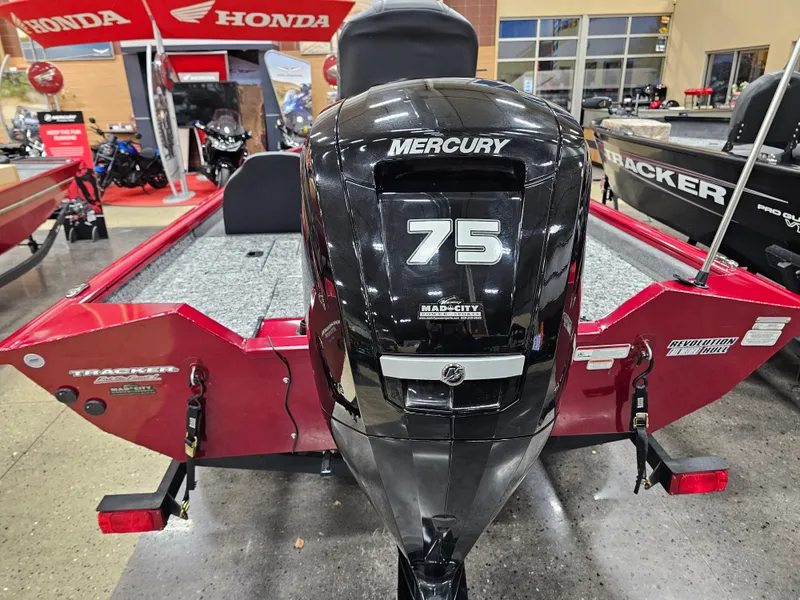 Slide: The Image of 2025 Tracker Pro Team 175 boat with Mercury 75 engine, displayed indoors. - 8
