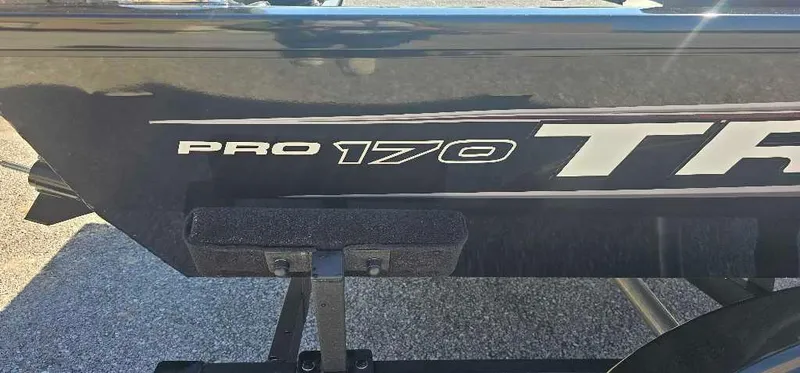 Slide: The Image of 2025 Tracker Pro 170 boat side view with logo and trailer. - 2