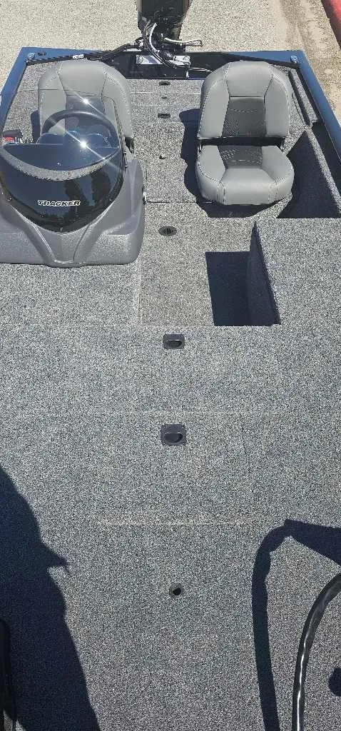 Slide: The Image of 2025 Tracker Pro 170 boat interior with seating and motor. - 4