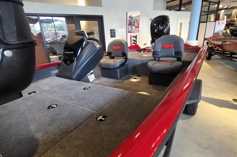 Slide: The Image of 2025 Tracker Pro Team 175 Crappie Edition boat interior with seating and motor. - 2