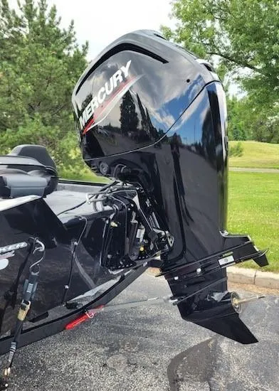 Slide: The Image of 2025 Tracker Pro Team 175 boat with Mercury outboard motor in a scenic setting. - 4