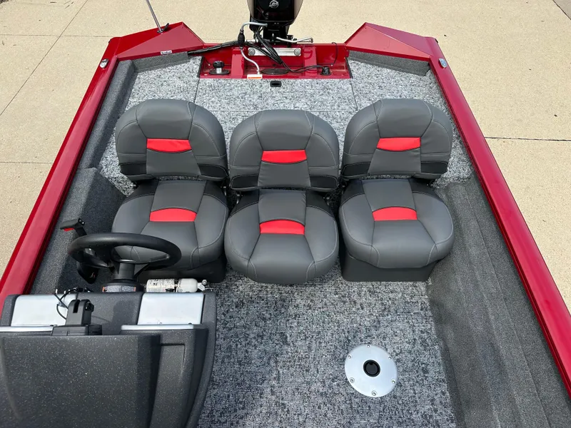 Slide: The Image of 2025 Tracker Pro Team 175 Crappie Edition boat interior with gray and red seating. - 5
