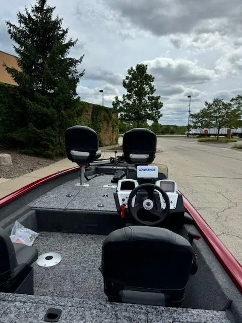 Slide: The Image of 2025 Tracker Pro Team 175 Crappie Edition boat with seating and control panel. - 2
