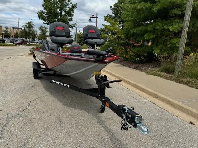 Slide: The Image of 2025 Tracker Pro Team 175 Crappie Edition boat on trailer in parking lot. - 5