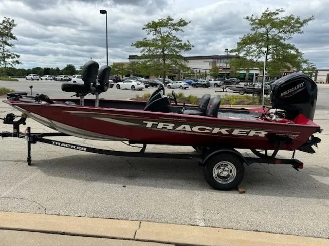 Slide: The Image of 2025 Tracker Pro Team 175 Crappie Edition boat on trailer in parking lot. - 6