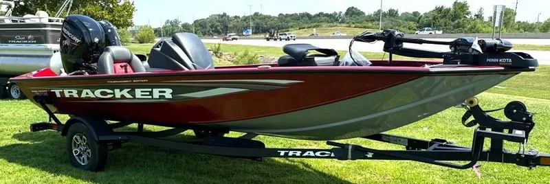 Slide: The Image of 2025 Tracker Pro Team 175 boat on trailer, parked on grass. - 5