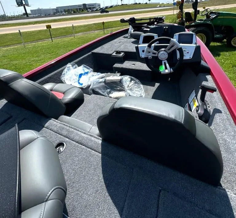 Slide: The Image of 2025 Tracker Pro Team 175 boat interior with steering wheel and seating. - 6