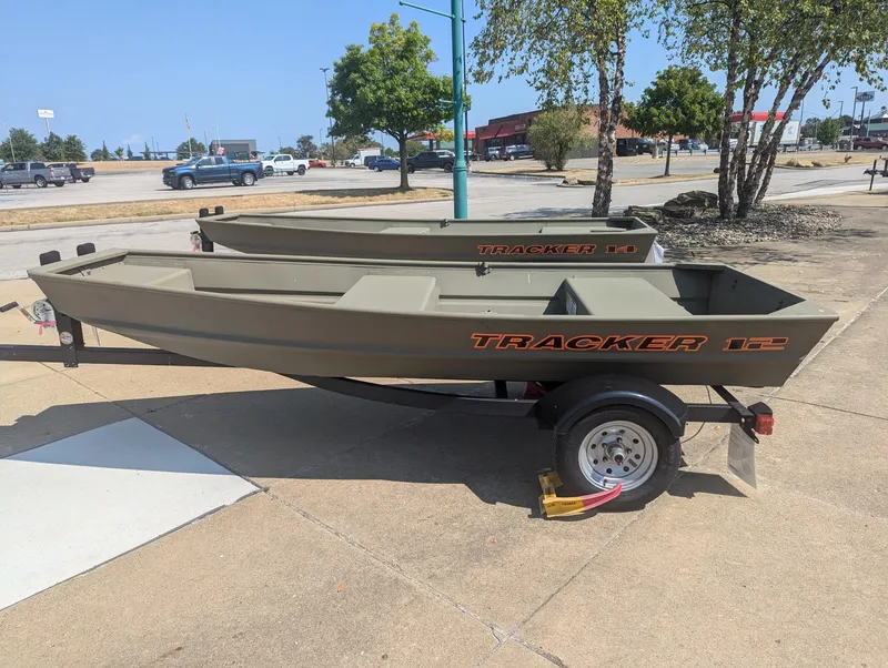 Slide: The Image of 2025 Tracker Grizzly 1236 Utility boat on trailer in parking lot. - 33