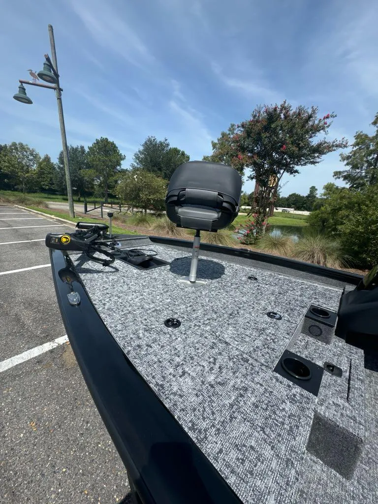 Slide: The Image of 2025 Tracker Pro Team 175 boat with fishing seat and equipment on deck. - 4