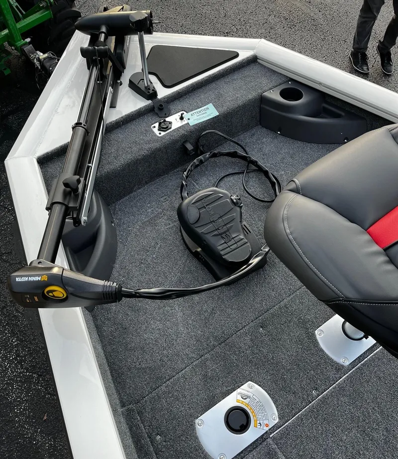 Slide: The Image of 2025 Tracker Pro Team 175 Crappie Edition boat interior with trolling motor and seating. - 2