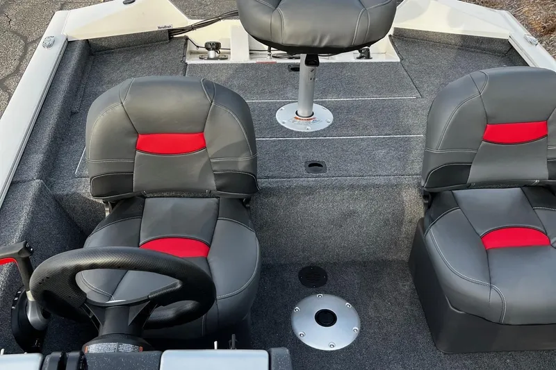Slide: The Image of 2025 Tracker Pro Team 175 Crappie Edition boat interior with gray and red seating. - 3