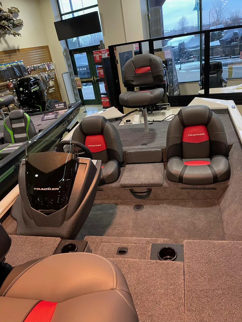 Slide: The Image of 2025 Tracker Pro Team 175 boat interior with seating and console display. - 2