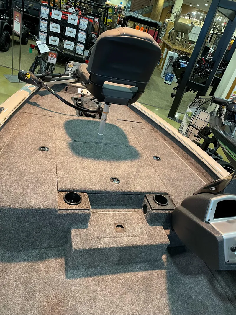 Slide: The Image of 2025 Tracker Pro Team 175 boat interior with seating and storage compartments. - 3