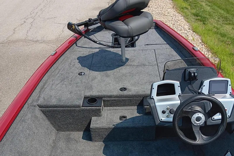 Slide: The Image of 2025 Tracker Pro Team 175 boat interior with steering wheel and seating. - 5