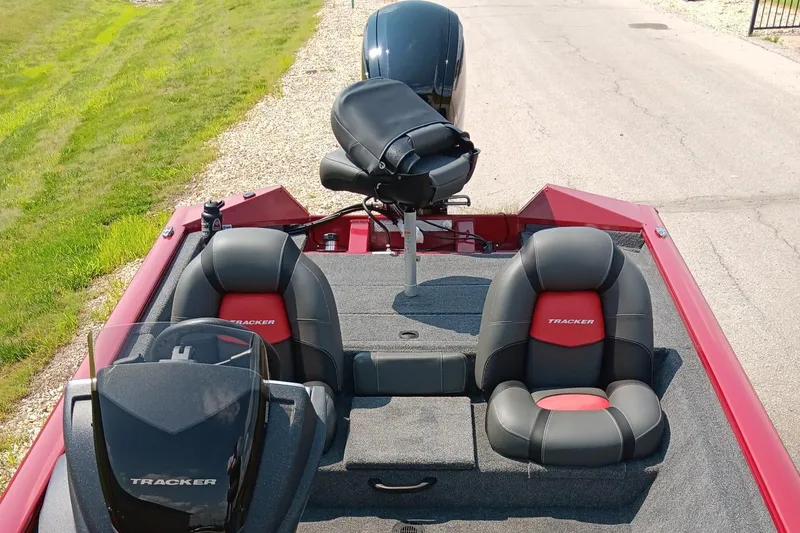 Slide: The Image of 2025 Tracker Pro Team 175 boat interior with seating and steering console. - 6