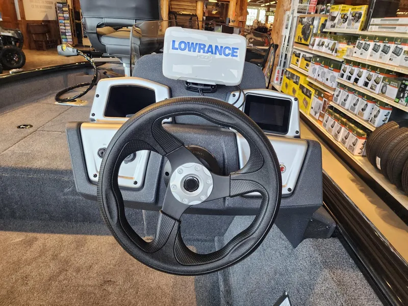 Slide: The Image of 2025 Tracker Pro Team 175 Crappie Edition boat dashboard with Lowrance electronics. - 3