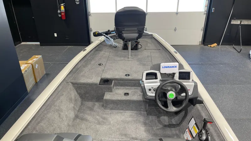 Slide: The Image of 2025 Tracker Pro Team 175 boat interior with steering wheel and navigation equipment. - 6