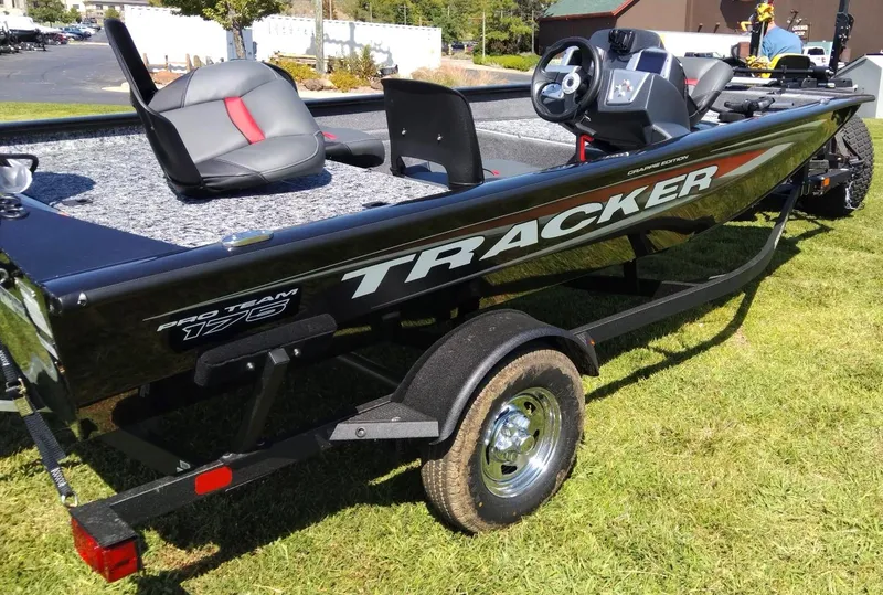 Slide: The Image of 2025 Tracker Pro Team 175 Crappie Edition boat on grass, side view. - 2
