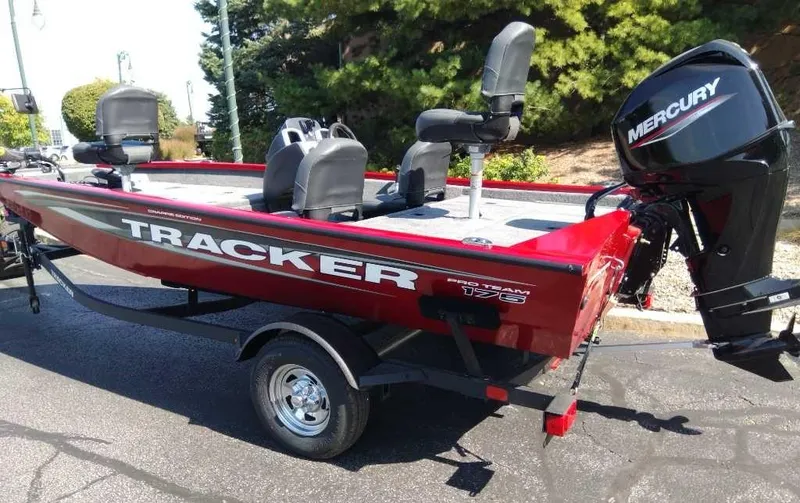 Slide: The Image of 2025 Tracker Pro Team 175 Crappie Edition boat with Mercury engine, red exterior. - 4