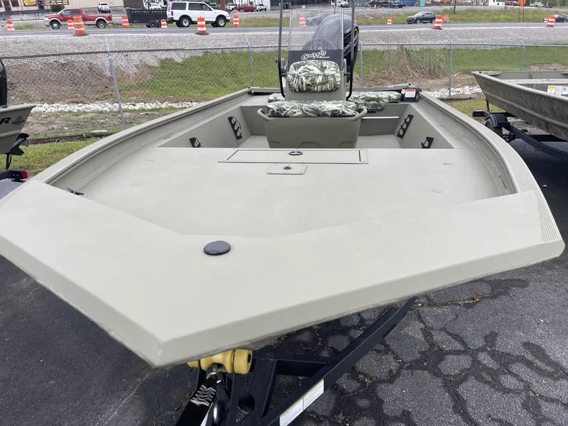 Slide: The Image of 2025 Tracker Grizzly 1860 CC boat on trailer, parked outdoors. - 2