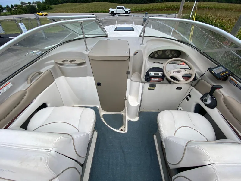 Slide: The Image of 2000 Bayliner 2352 Capri DX/LX boat interior with steering wheel and seating. - 14