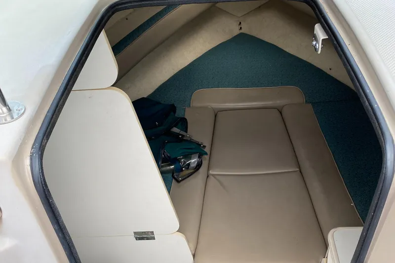 Slide: The Image of Interior cabin of 2000 Bayliner 2352 Capri DX/LX with beige seating. - 19