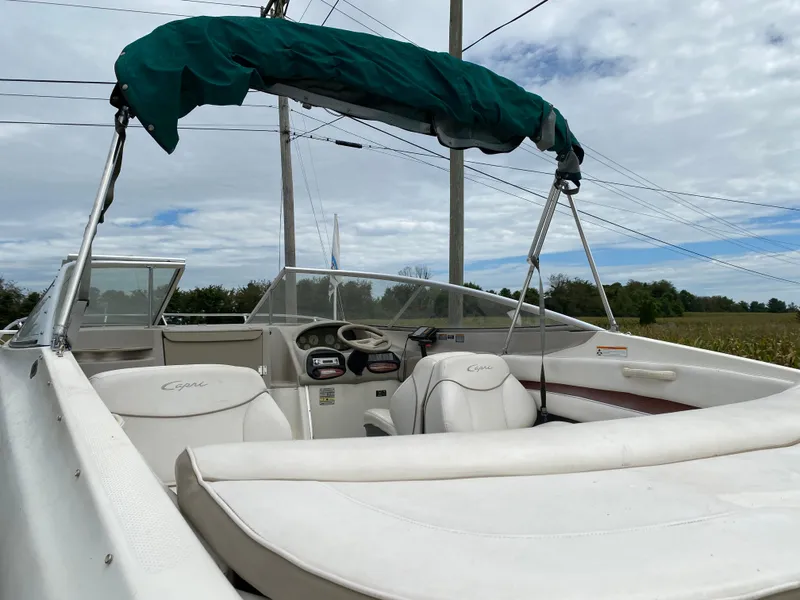 Slide: The Image of 2000 Bayliner 2352 Capri DX/LX boat with canopy and white interior. - 29