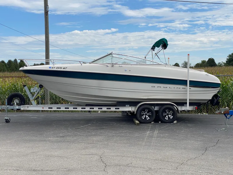 Slide: The Image of 2000 Bayliner 2352 Capri DX/LX boat on trailer, parked outdoors. - 38