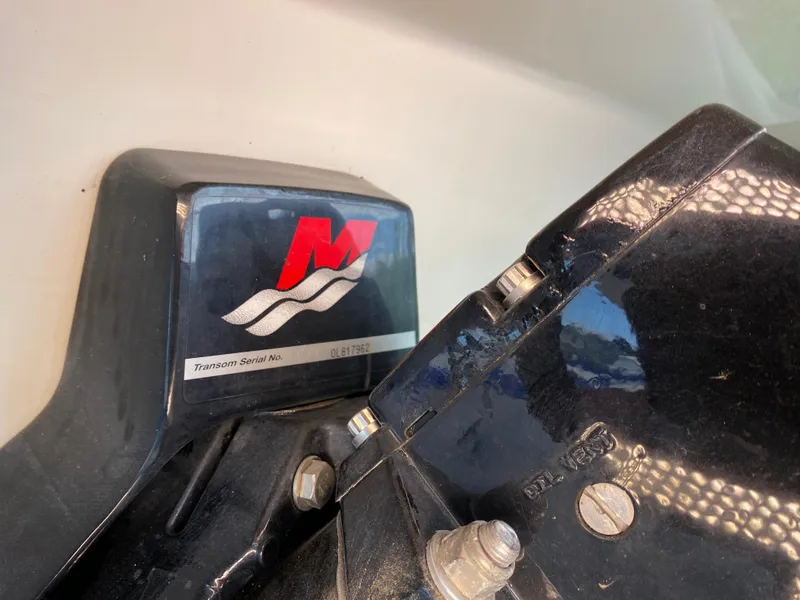 Slide: The Image of Close-up of a 2000 Bayliner 2352 Capri DX/LX boat engine component. - 44