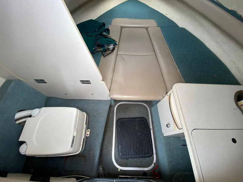 Slide: The Image of Interior of 2000 Bayliner 2352 Capri DX/LX boat with seating and storage. - 6