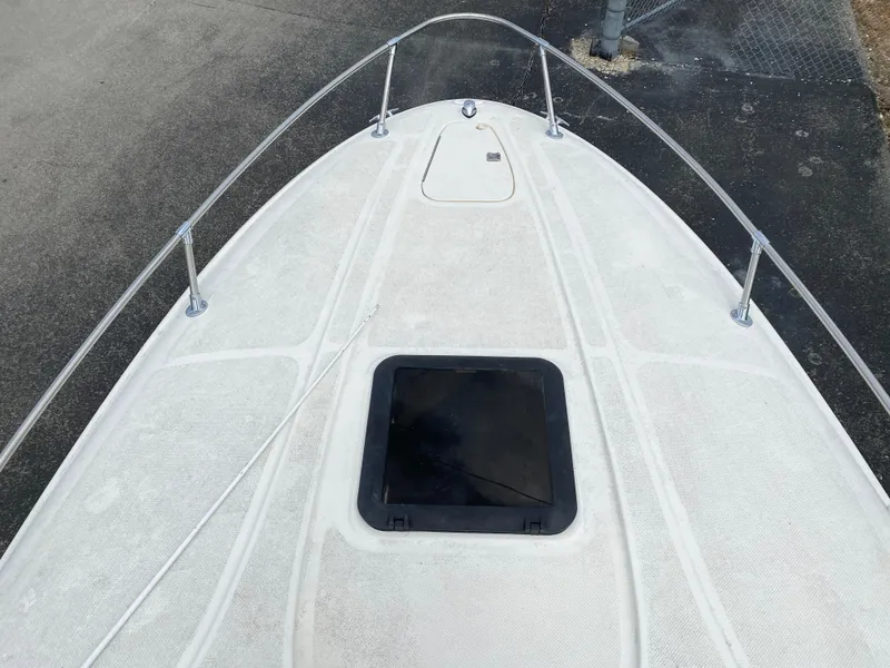 Slide: The Image of 2000 Bayliner 2352 Capri DX/LX boat deck with hatch and railing. - 7