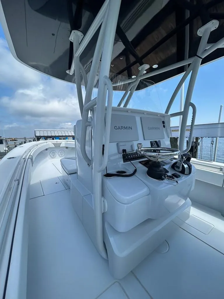 Slide: The Image of 2021 Contender 35 ST boat with Garmin electronics, sleek design, and spacious deck. - 4