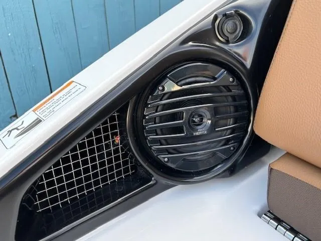 Slide: The Image of Close-up of 2025 Yamaha Boats 252SD speaker and seating detail. - 13