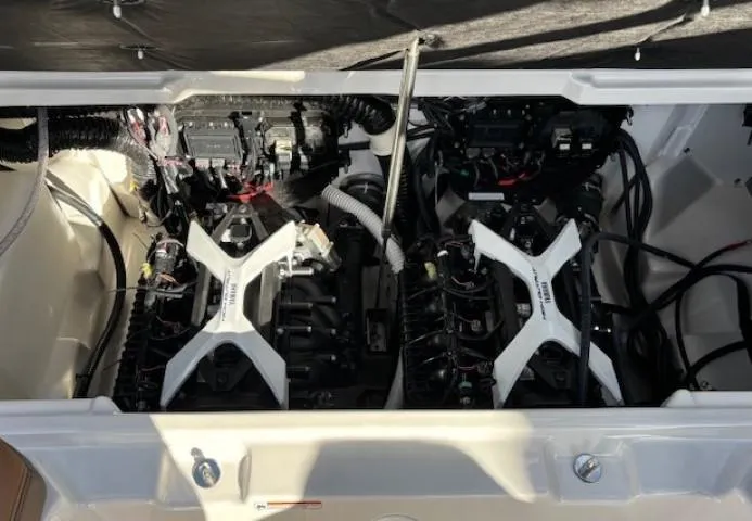 Slide: The Image of 2025 Yamaha Boats 252SD engine compartment with dual engines and wiring. - 15