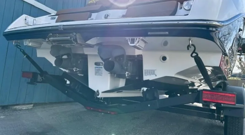 Slide: The Image of 2025 Yamaha Boats 252SD on trailer, rear view showing dual engines. - 4