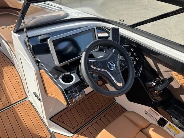 Slide: The Image of 2025 Yamaha Boats 252SD dashboard with modern steering and touchscreen display. - 9