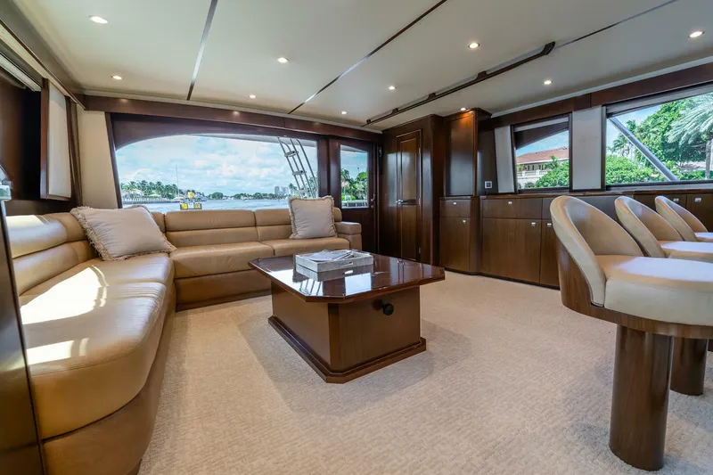 Slide: The Image of Luxurious interior of 2015 Viking 76 Convertible yacht with plush seating and elegant wood finishes. - 10