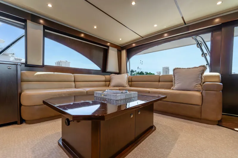 Slide: The Image of Luxurious interior of 2015 Viking 76 Convertible yacht with plush seating and elegant decor. - 11