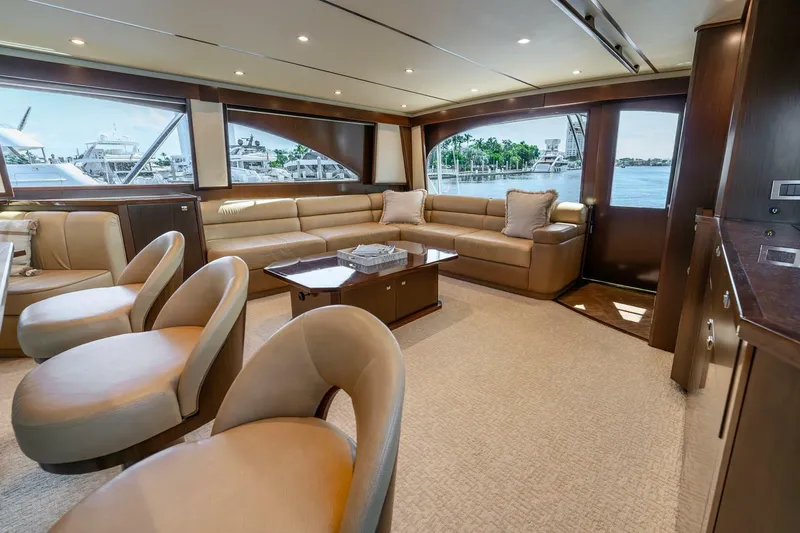 Slide: The Image of Luxurious interior of 2015 Viking 76 Convertible yacht with elegant seating and large windows. - 12