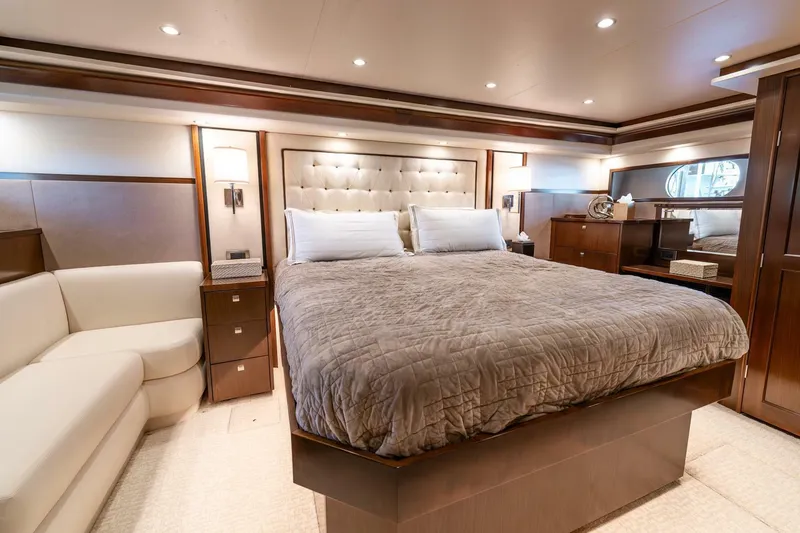 Slide: The Image of Luxurious bedroom interior of 2015 Viking 76 Convertible yacht with elegant furnishings. - 16
