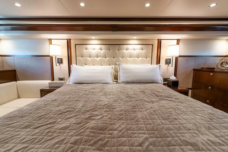 Slide: The Image of Luxurious bedroom interior of 2015 Viking 76 Convertible yacht with elegant bedding and lighting. - 17