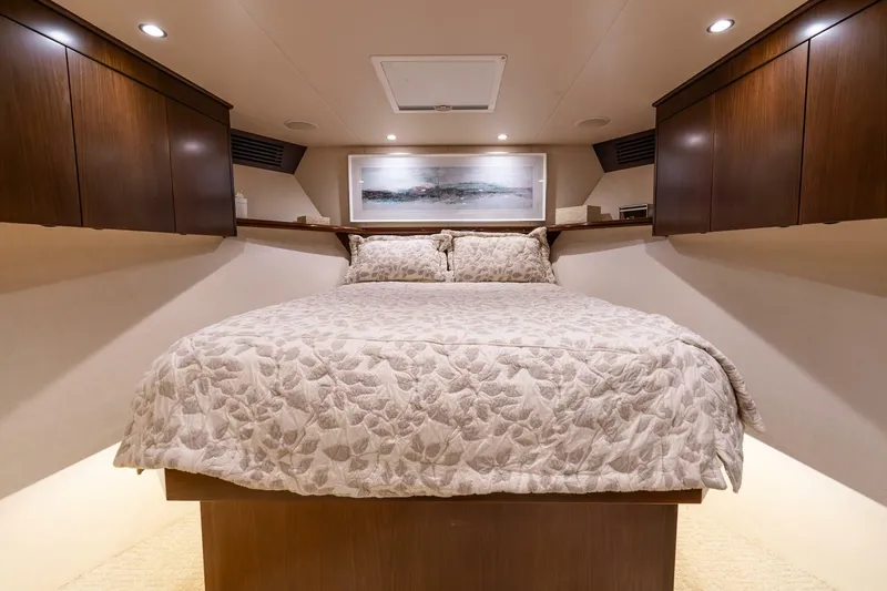 Slide: The Image of Luxurious bedroom interior of 2015 Viking 76 Convertible yacht with elegant bedding. - 18