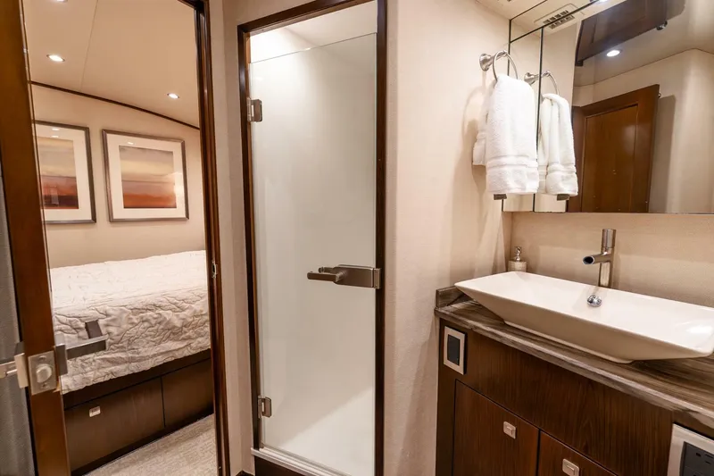 Slide: The Image of Luxurious bathroom and bedroom in 2015 Viking 76 Convertible yacht. - 20