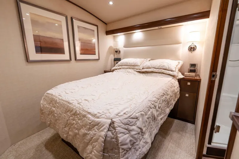 Slide: The Image of Luxurious bedroom interior of 2015 Viking 76 Convertible yacht with cozy bedding. - 21