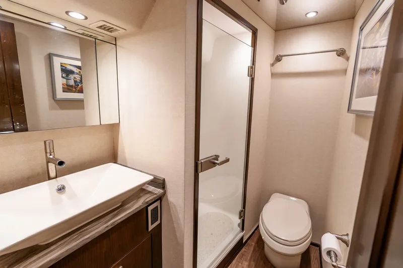 Slide: The Image of Luxurious bathroom in 2015 Viking 76 Convertible yacht with modern fixtures and shower. - 23