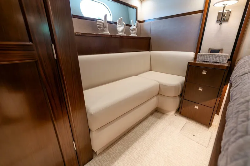 Slide: The Image of Luxurious interior of 2015 Viking 76 Convertible yacht with plush seating and elegant decor. - 24