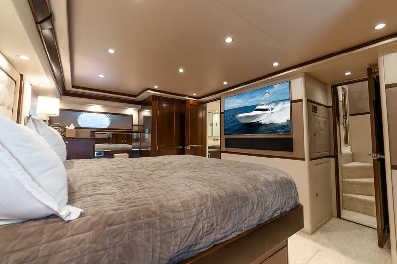 Slide: The Image of Luxurious bedroom interior of 2015 Viking 76 Convertible yacht with modern decor. - 28