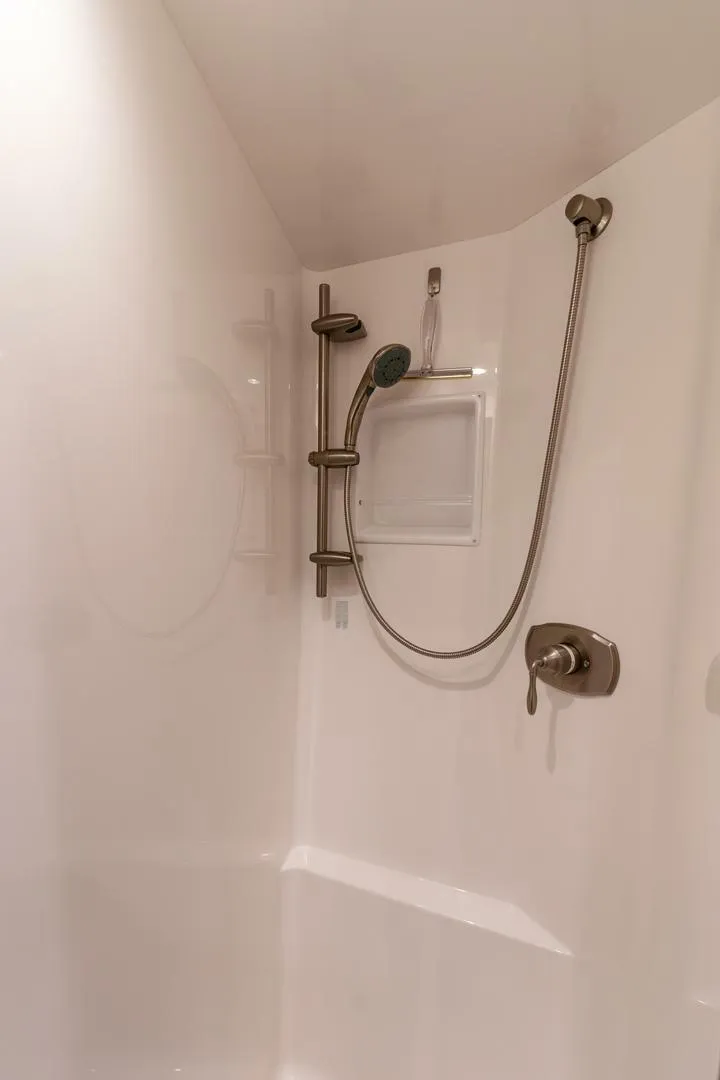 Slide: The Image of Shower area in 2015 Viking 76 Convertible yacht with modern fixtures. - 34
