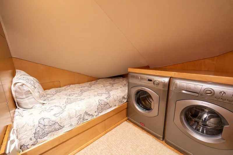 Slide: The Image of Cozy cabin with bed and laundry area in 2015 Viking 76 Convertible yacht. - 39